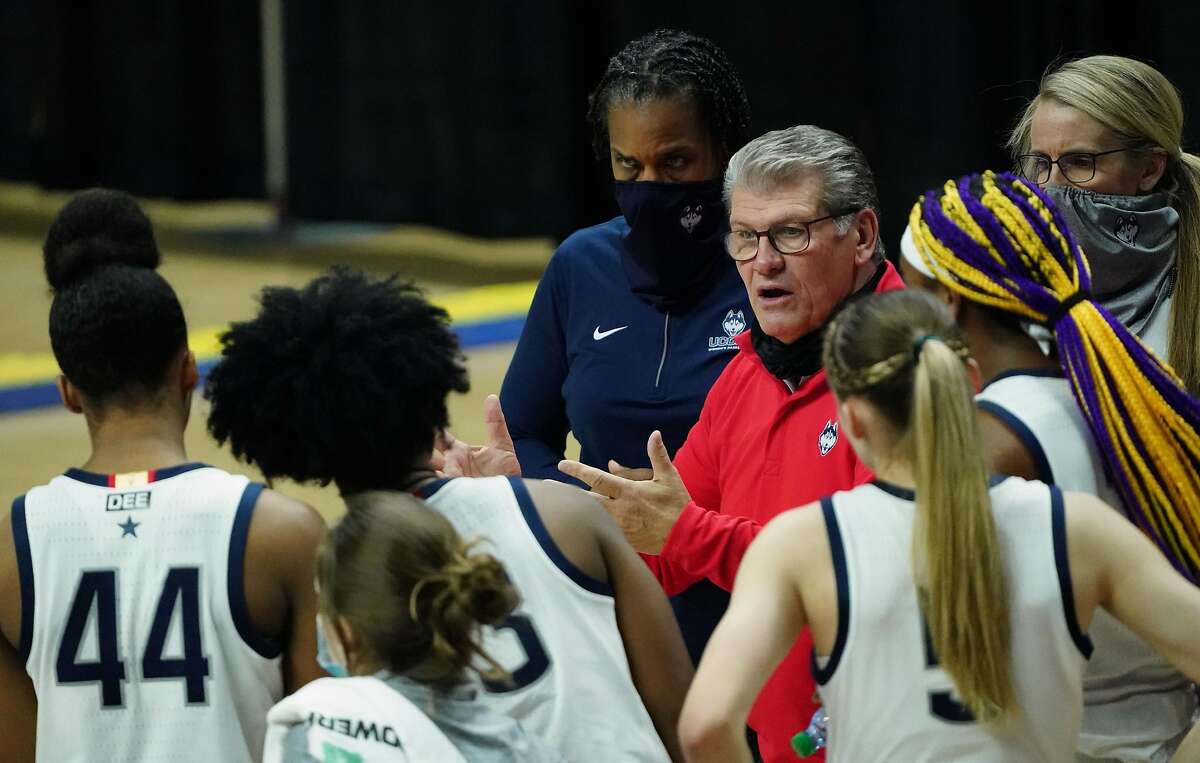 UConn head coach Geno Auriemma talks to his player during a break in the action Tuesday in Storrs, Conn.