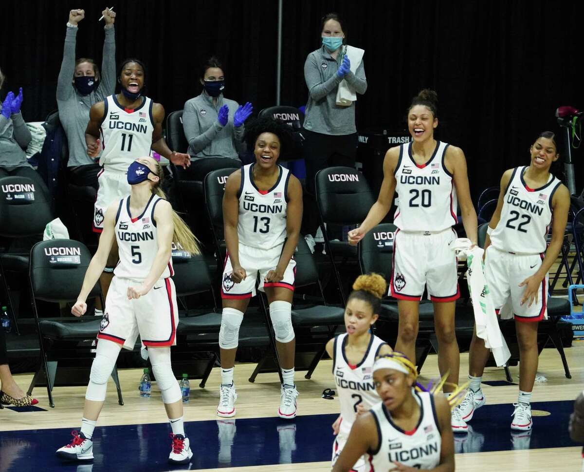 The UConn Huskies bench reacts after a three point basket by Huskies guard Autumn Chassion (2) against the Butler Bulldogs in the second half at Harry A. Gampel Pavilion.
