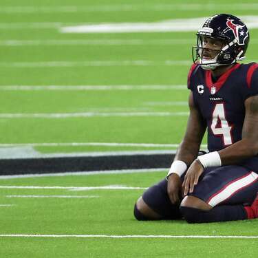 Houston Texans quarterback Deshaun Watson kneels on the field after failing convert on third down near the end of the game against the Tennessee Titans during the fourth quarter of an NFL football game at NRG Stadium on Sunday, Jan. 3, 2021, in Houston.