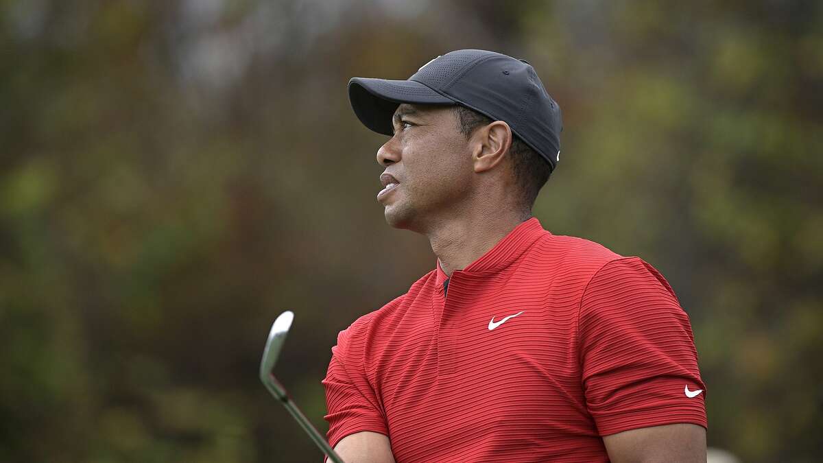Tiger Woods watches his tee shot on the 12th hole during the final round of the PNC Championship golf tournament, Sunday, Dec. 20, 2020, in Orlando, Fla. (AP Photo/Phelan M. Ebenhack)