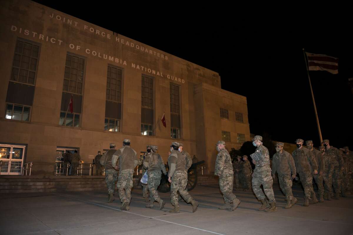 Members of the Connecticut National Guard, 141st Ground Ambulance Company arrive at the D.C. Armory, Jan. 17, 2021, Washington, D.C. At least 25,000 National Guard men and women have been authorized to conduct security, communication and logistical missions in support of federal and District authorities leading up and through the 59th Presidential Inauguration.