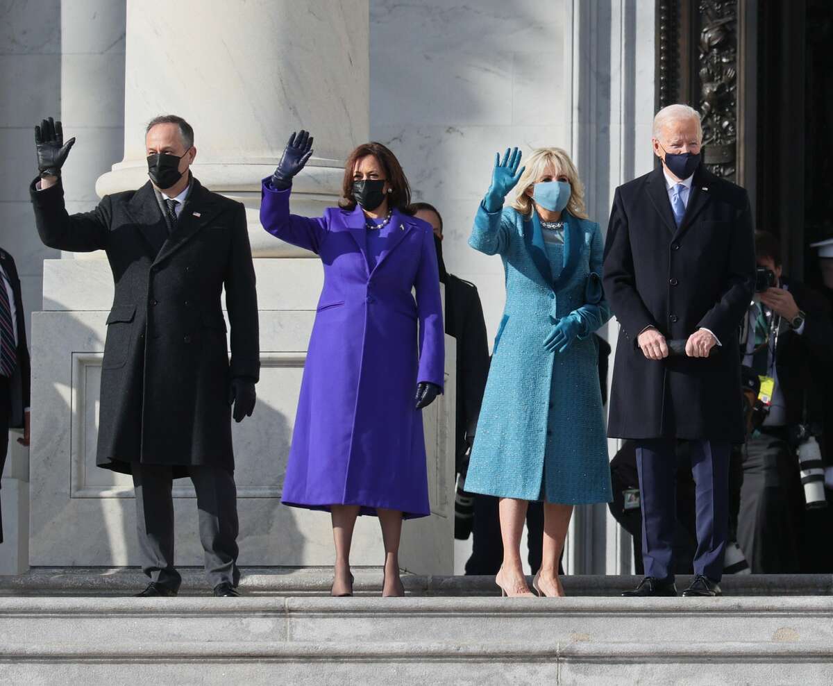 WASHINGTON, DC - JANUARY 20: (EDITOR'S NOTE: Alternate crop) (L-R) Doug Emhoff, U.S. Vice President-elect Kamala Harris, Jill Biden and President-elect Joe Biden wave as they arrive on the East Front of the U.S. Capitol for the inauguration on January 20, 2021 in Washington, DC. During today's inauguration ceremony Joe Biden becomes the 46th president of the United States. (Photo by Joe Raedle/Getty Images)