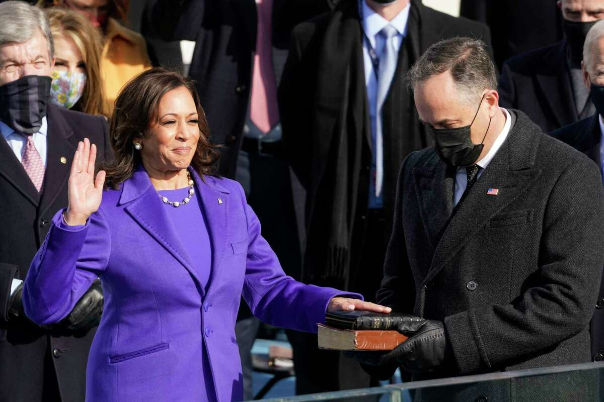Kamala Harris is sworn in as vice president by Supreme Court Justice Sonia Sotomayor as her husband Doug Emhoff holds the Bible during the 59th Presidential Inauguration at the U.S. Capitol in Washington, Wednesday, Jan. 20, 2021.