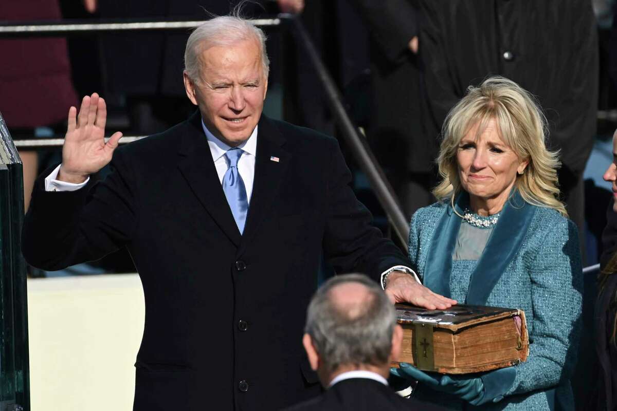 Joe Biden is sworn in as the 46th president of the United States by Chief Justice John Roberts as Jill Biden holds the Bible during the 59th Presidential Inauguration at the U.S. Capitol in Washington, Wednesday, Jan. 20, 2021.(Saul Loeb/Pool Photo via AP)