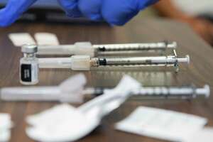 Nearly 1,500 doses of COVID vaccines went to waste from Texas...