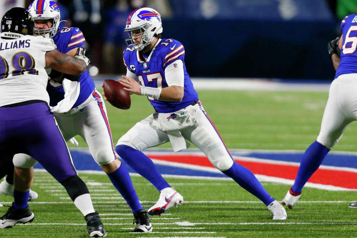 Buffalo Bills quarterback Josh Allen (17) carries the ball during the first half of an NFL football game against the Baltimore Ravens in Orchard park, N.Y., Saturday Jan. 16, 2021. The game attracted a season-high average audience of about 27 million for Stamford-based NBC Sports.