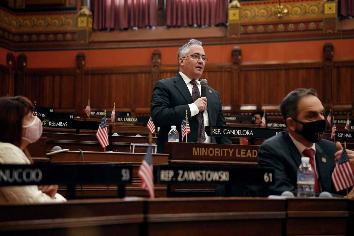 Newly sworn in Connecticut House Minority Leader Vincent Candelora, R-North Branford, speaks in the House during opening session at the State Capitol, Jan. 6, 2021, in Hartford, Conn. The new legislative session is expected to focus on the continuing coronavirus pandemic and the state's budget challenges. (AP Photo/Jessica Hill)