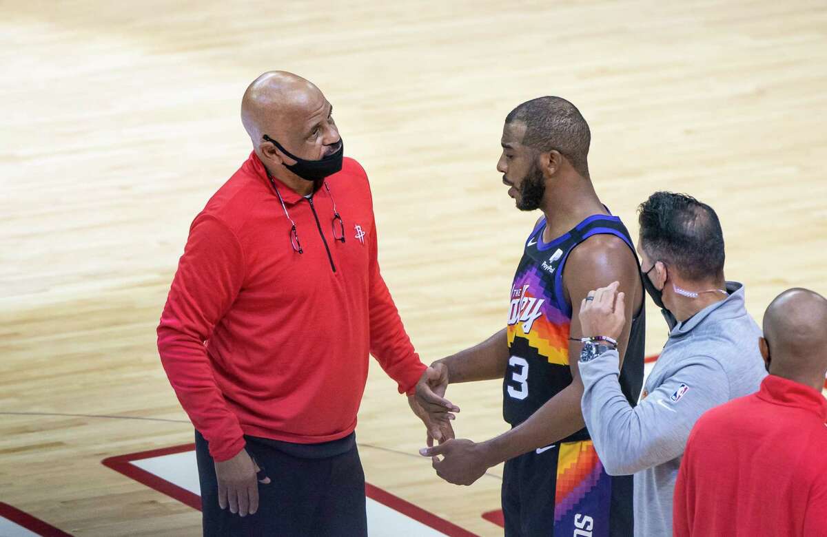 Rockets assistant coach John Lucas talks with Phoenix Suns guard Chris Paul (3) after the fourth quarter of an NBA game between the Houston Rockets and Phoenix Suns on Wednesday, Jan. 20, 2021, at Toyota Center in Houston.