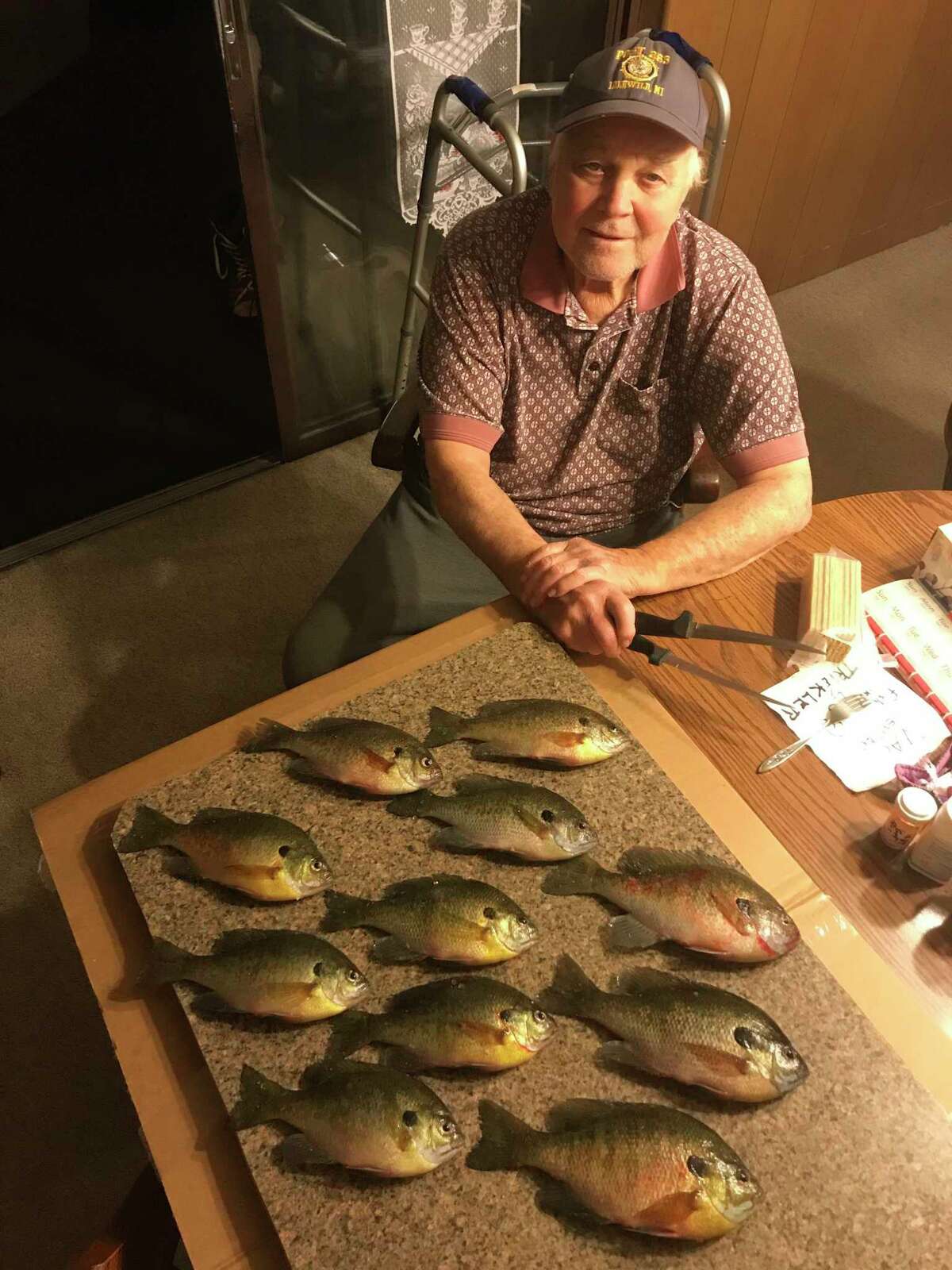 Baldwin's Jim Warren enjoys the rewards of his recent ice fishing venture. (Courtesy photo)