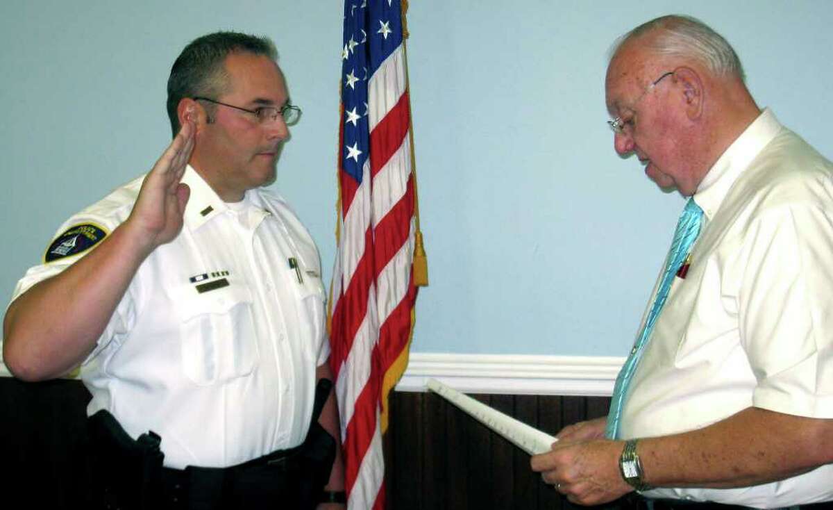 New Milford Police Department Mark Buckley is sworn in Friday, Sept. 3, 2010 by Town Clerk George Buckbee as a lieuteant. Lt. Buckley was hired as an NMPD officer in 1990, was promoted to sergeant in 1999 and administrative sergeant in 2002.