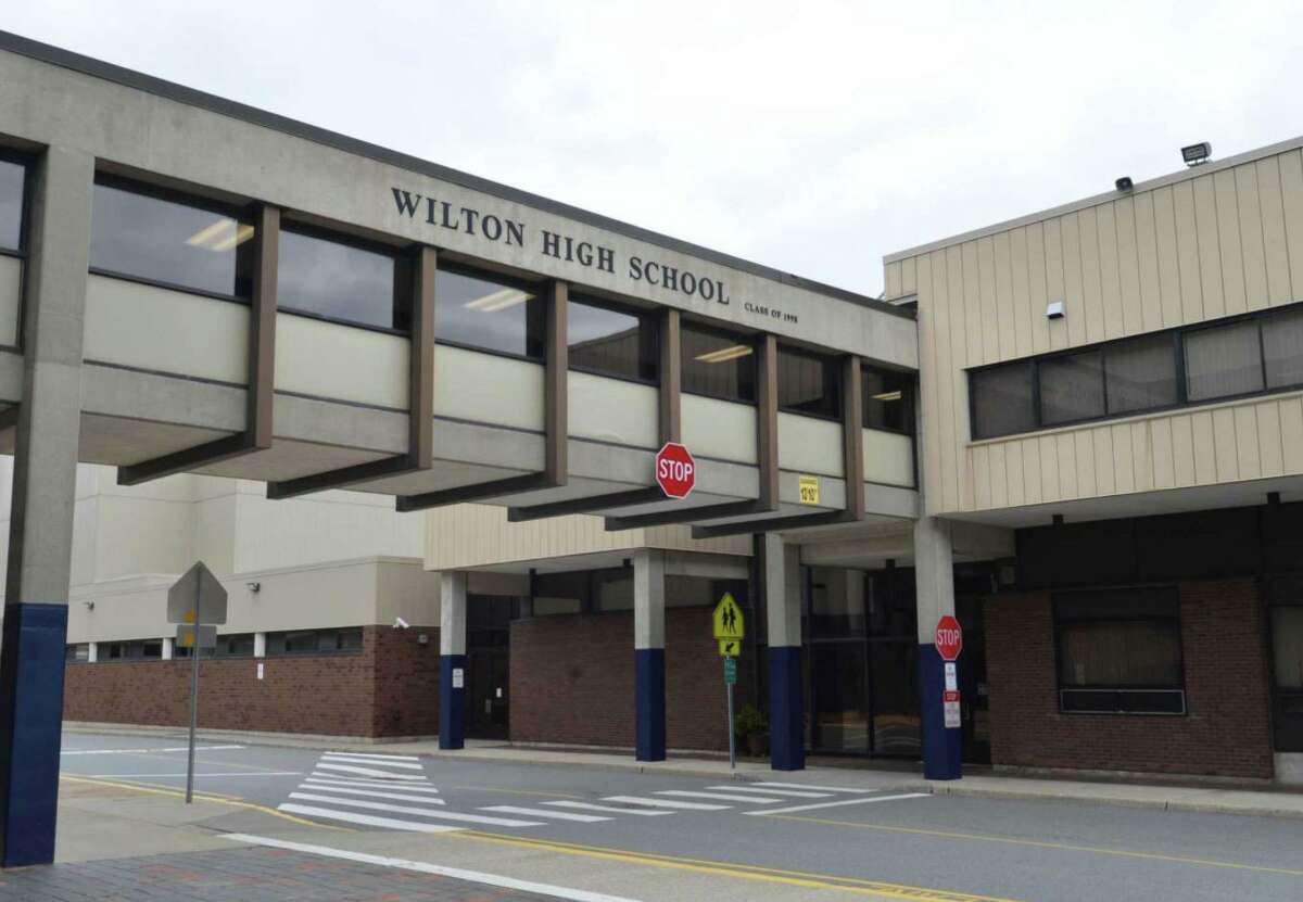 Wilton High School remains on distance learning due to a COVID outbreak that the town’s health director stems from several teen parties.