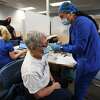 Senior Beverly Rosner, of Shelton, receives the first dose of the two part Covid-19 vaccine from nurse Raola Vigil, RN, at the Griffin Health Vaccination Center at 10 Progress Drive in Shelton, Conn. on Wednesday, January 20, 2021.