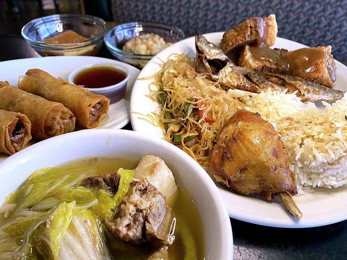 The lunch buffet at Susie’s Lumpia House on Culebra Road includes, clockwise from front, beef-shank soup, fried lumpia, leche flan, rice pudding, lechom kawali, fried scrod, pancit and pork adobo.