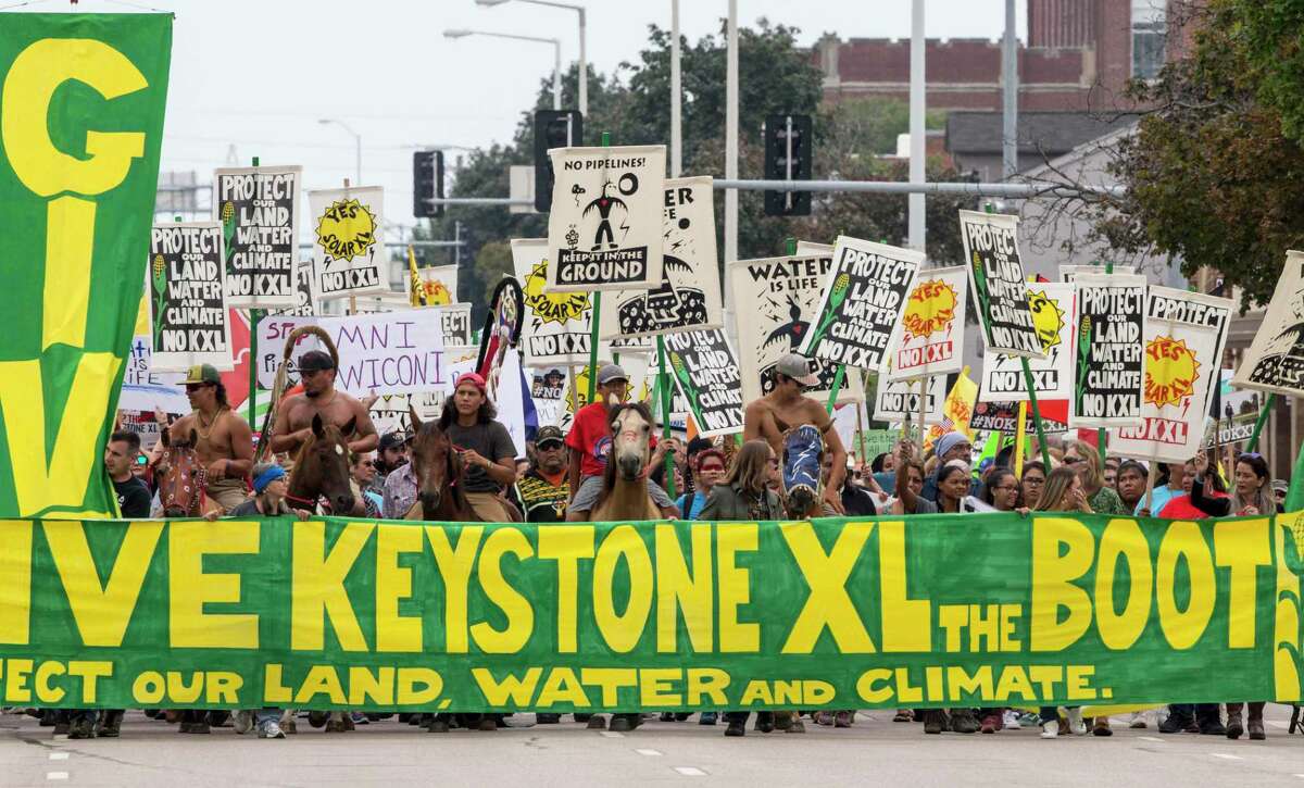 Protesters in 2017 march against the Keystone XL pipeline. Despite rhetoric from the left, the pipeline is not a tipping point in addressing climate change.
