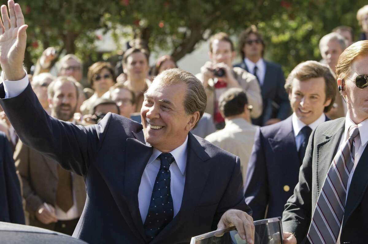 (L to R) Richard Nixon (played by Frank Langella) greets an audience while David Frost (played by Michael Sheen) looks on in a drama that tells of the electrifying battle between a disgraced president with a legacy to save and a jet-setting television personality with a name to make in “Frost/Nixon,” from director Ron Howard.