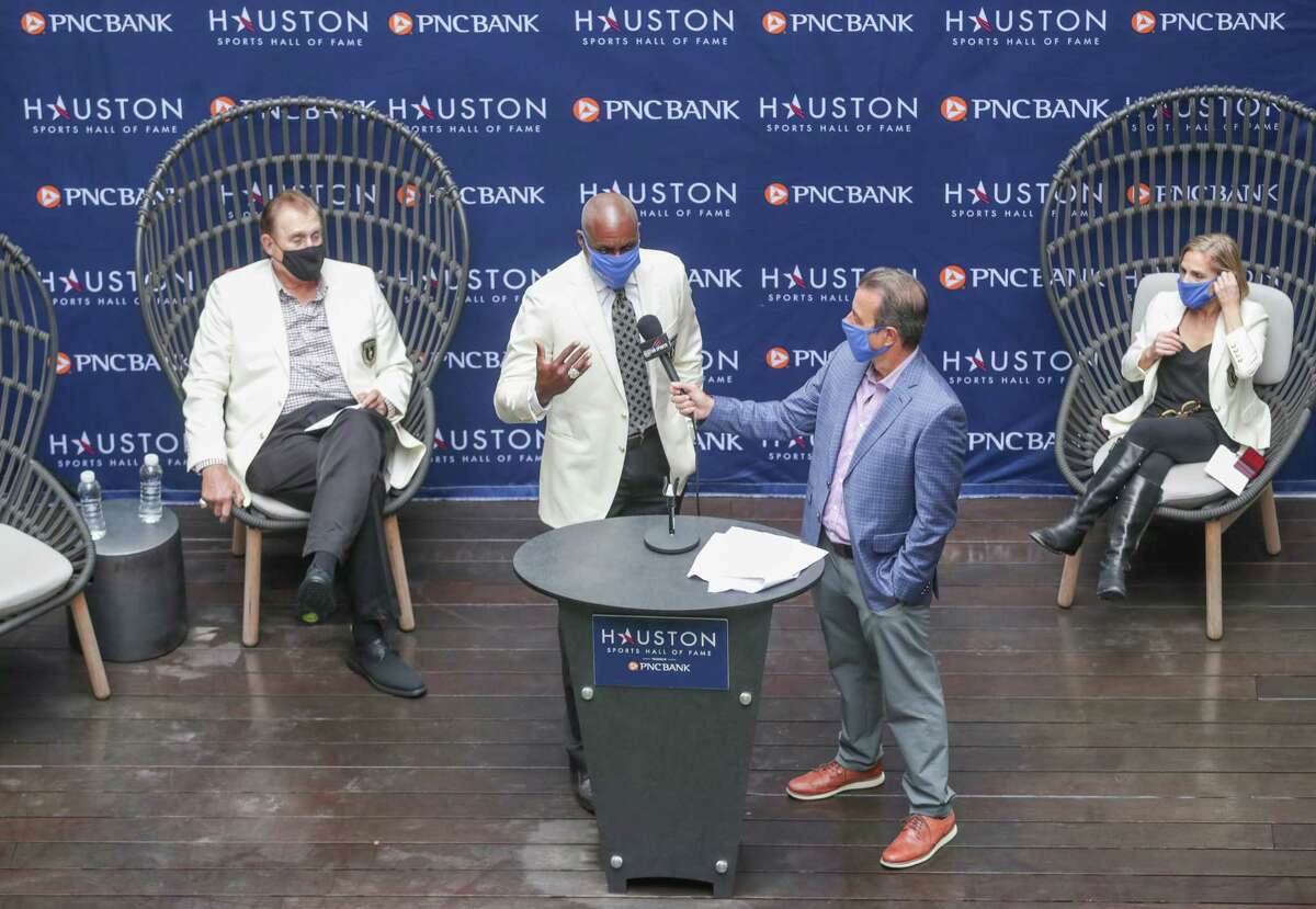 Carl Lewis talks during the Houston Sports Hall of Fame Ring Presentation and Walk of Fame Unveiling Thursday, Jan. 21, 2021, in Houston. Lewis, Mary Lou Retton, Rudy Tomjanovich and the late Bob Lanier were honored at the event