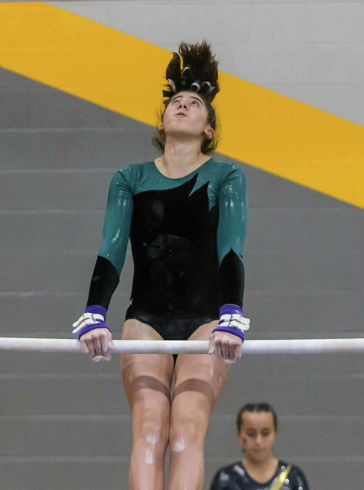 Guilford Gymnast Ella Esposito was a top finisher in the bars during the SCC gymnastics championship.