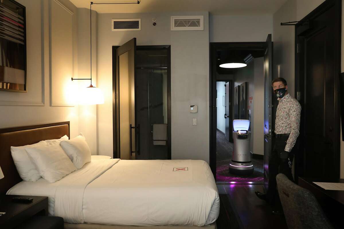 Manager Jeremy Kueffner shows a room at the Hotel Axiom and Astro in San Francisco.