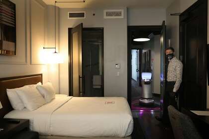 Manager Jeremy Kueffner shows a room at the Hotel Axiom and Astro in San Francisco.