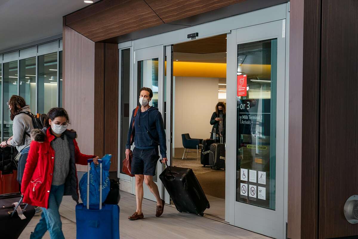 A traveler exits San Francisco International Airport.