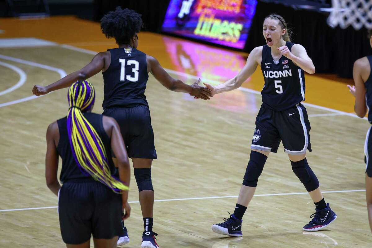 Jan 21, 2021; Knoxville, Tennessee, USA; UConn Huskies guard Christyn Williams (13) and guard Paige Bueckers (5) celebrate a play against the Tennessee Lady Vols during the second half at Thompson-Boling Arena. Mandatory Credit: Randy Sartin-USA TODAY Sports