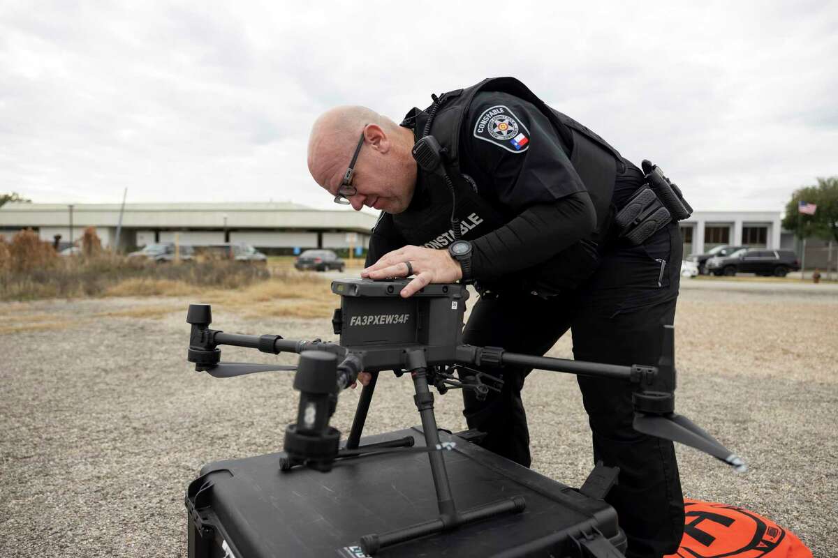Deputy Dodge prepares a drone near the Montgomery County Precinct 4 Constable's Office, Tuesday, Jan. 19, 2021, in New Caney. The drone can stay inflight for an estimated 40 minutes with one set of batteries and fly a distance of 15 miles without losing signal.