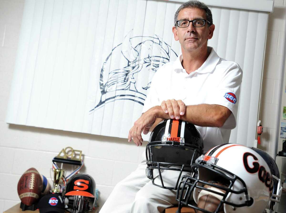Shelton High School athletic director John Niski poses for a photograph in his office at the school in Shelton, Conn.