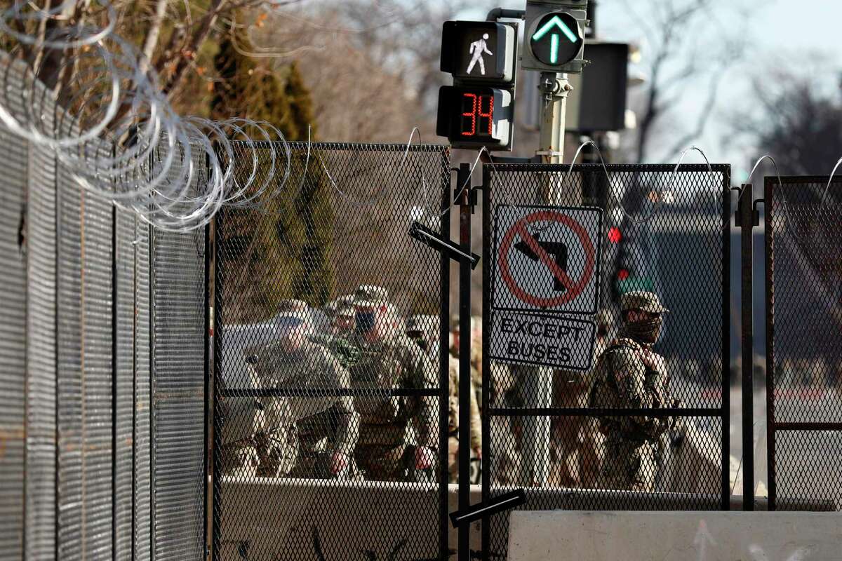 National Guard troops continue to be deployed around the Capitol a day after the inauguration of President Joe Biden.