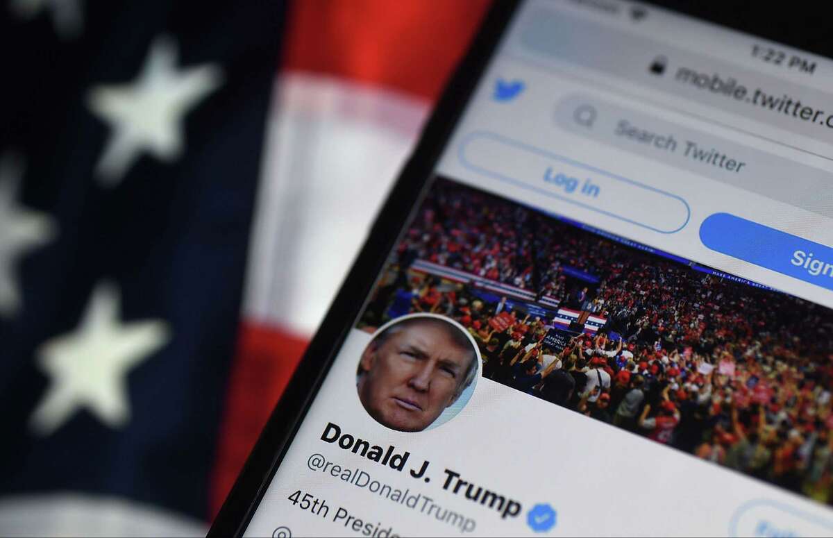 In this photo illustration, the Twitter account of former President Donald Trump is displayed on a mobile phone.