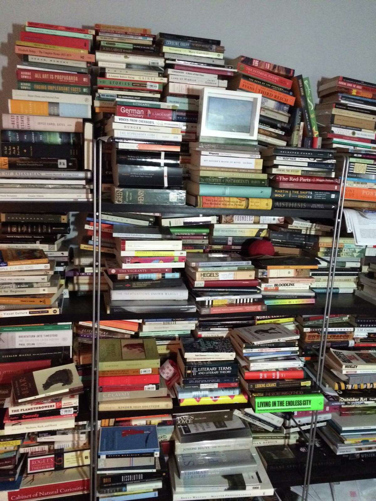 Shelves filled with books are much harder to manage than a Kindle Fire. De-clutter!