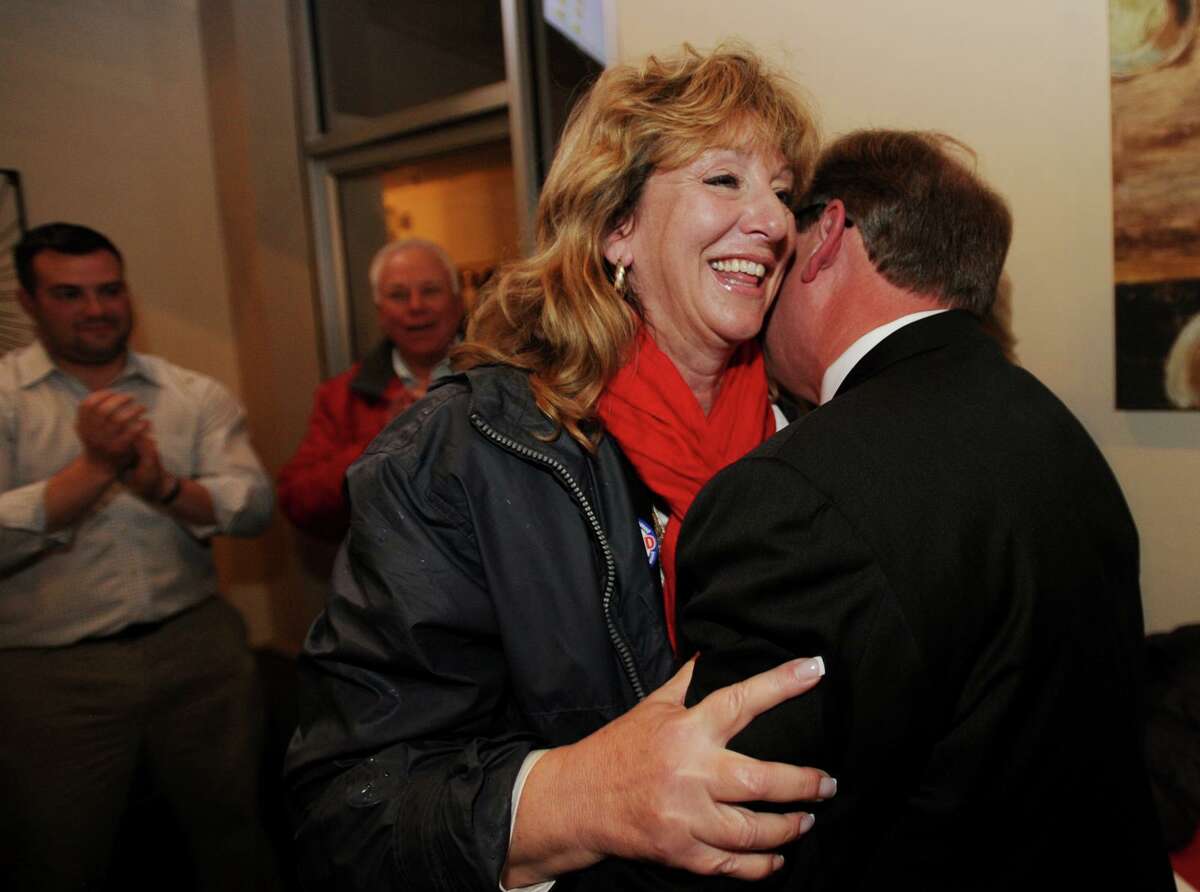A file photo showing newly elected Stratford Mayor Laura Hoydick hugs outgoing Mayor John Harkins at her victory party at the Riverview Bistro restaurant in Stratford, Conn. on Tuesday, November 7, 2017.