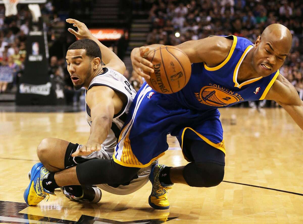 San Antonio Spurs' Cory Joseph scrambles for a loose ball against Golden State Warriors' Jarrett Jack during the second half of Game 1 in the NBA Western Conference semifinals at the AT&T Center, Monday, May 6, 2013. The Spurs won in double overtime 129-127.
