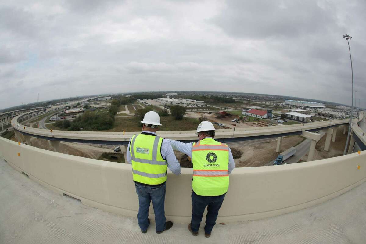 Sam Sauceda and Sean Lind take in the view on the ramp from the southbound Texas 288 Tollway to the eastbound Sam Houston Tollway on Nov. 13, 2020, in Houston.