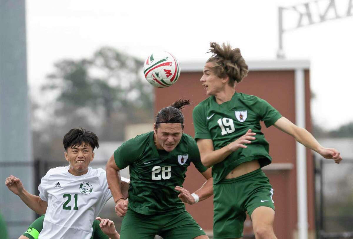 The Woodlands defensive midfielder Davin Hickman-Chow heads the ball during the first half of a Highlander Invitational soccer match against Klein Forest at Woodforest Bank Stadium, Friday, Jan. 22, 2021, in Shenandoah.