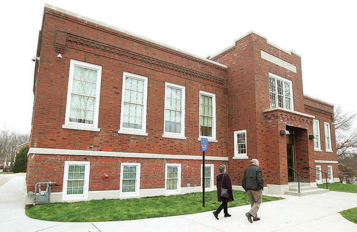 Visitors enter the Mannie Jackson Center for the Humanities at the historic former Lincoln School on Main Streert in Edwardsville in December 2015, just after it opened.