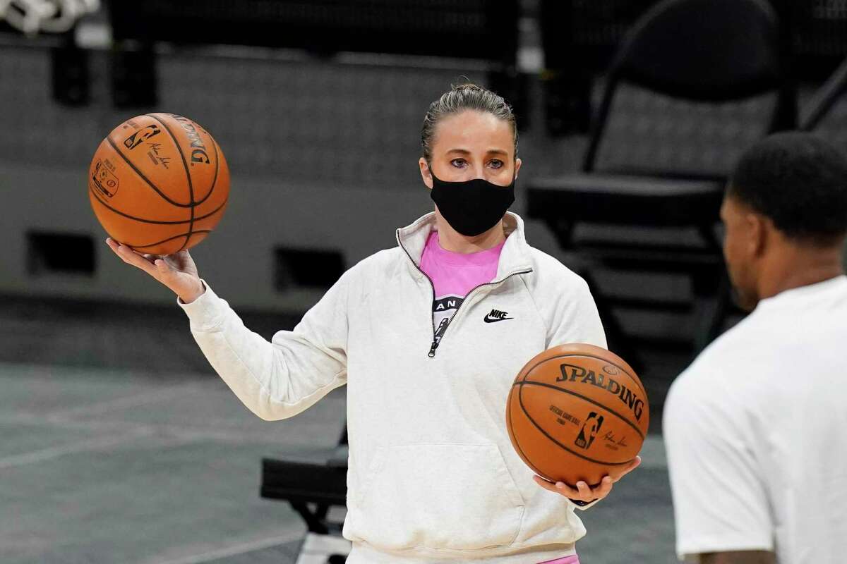 San Antonio Spurs assistant coach Becky Hammon works with Spurs forward Rudy Gay (22) before an NBA basketball game against the Dallas Mavericks in San Antonio, Friday, Jan. 22, 2021. (AP Photo/Eric Gay)
