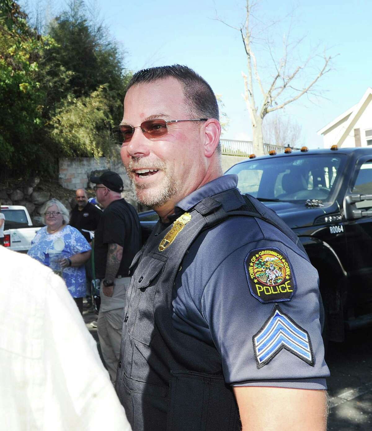 Greenwich Police Sgt. John Thorme smiles during the "Thank a Cop" law enforcement appreciation day event at Joey B's Chili Hub in the Cos Cob section of Greenwich, Conn., Wednesday, Sept. 27, 2017. Donations made by the public went to the college scholarship fund for the families of Greenwich law enforcement.