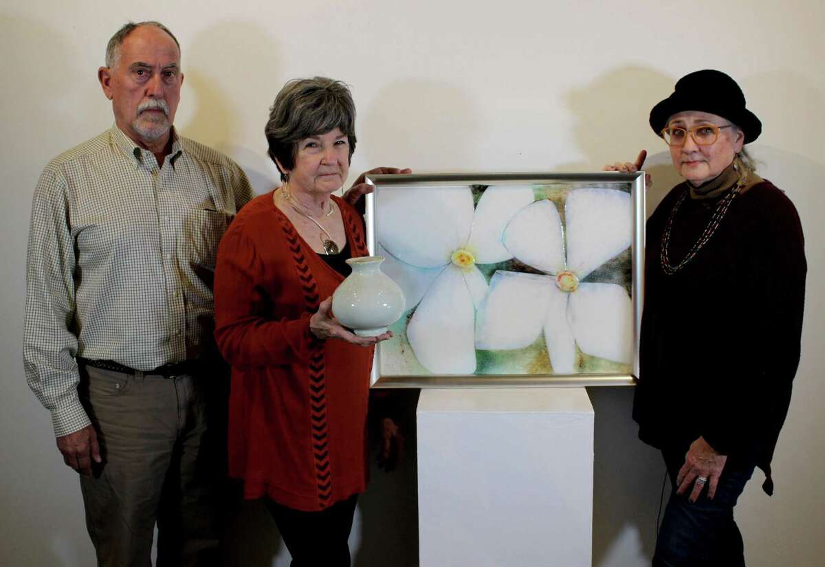 Artists Gene Hester, Carol Berger and Liz Conces Spencer with the auction package to benefit Houston Arboretum & Nature Center