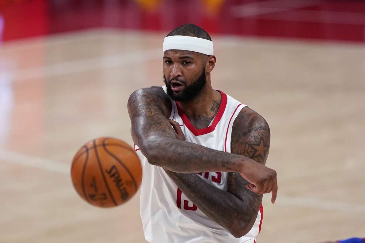 Houston Rockets center DeMarcus Cousins passes during the second half of an NBA basketball game against the Detroit Pistons Friday, Jan. 22, 2021, in Detroit. (AP Photo/Carlos Osorio)