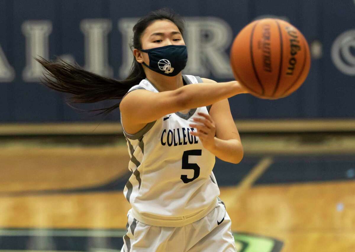 FILE PHOTO — College Park shooting guard Mia Olguin (5) passes the ball during the third quarter of a District 13-6A girls basketball game against Conroe at College Park High School, Saturday, Jan. 16, 2021, in The Woodlands.