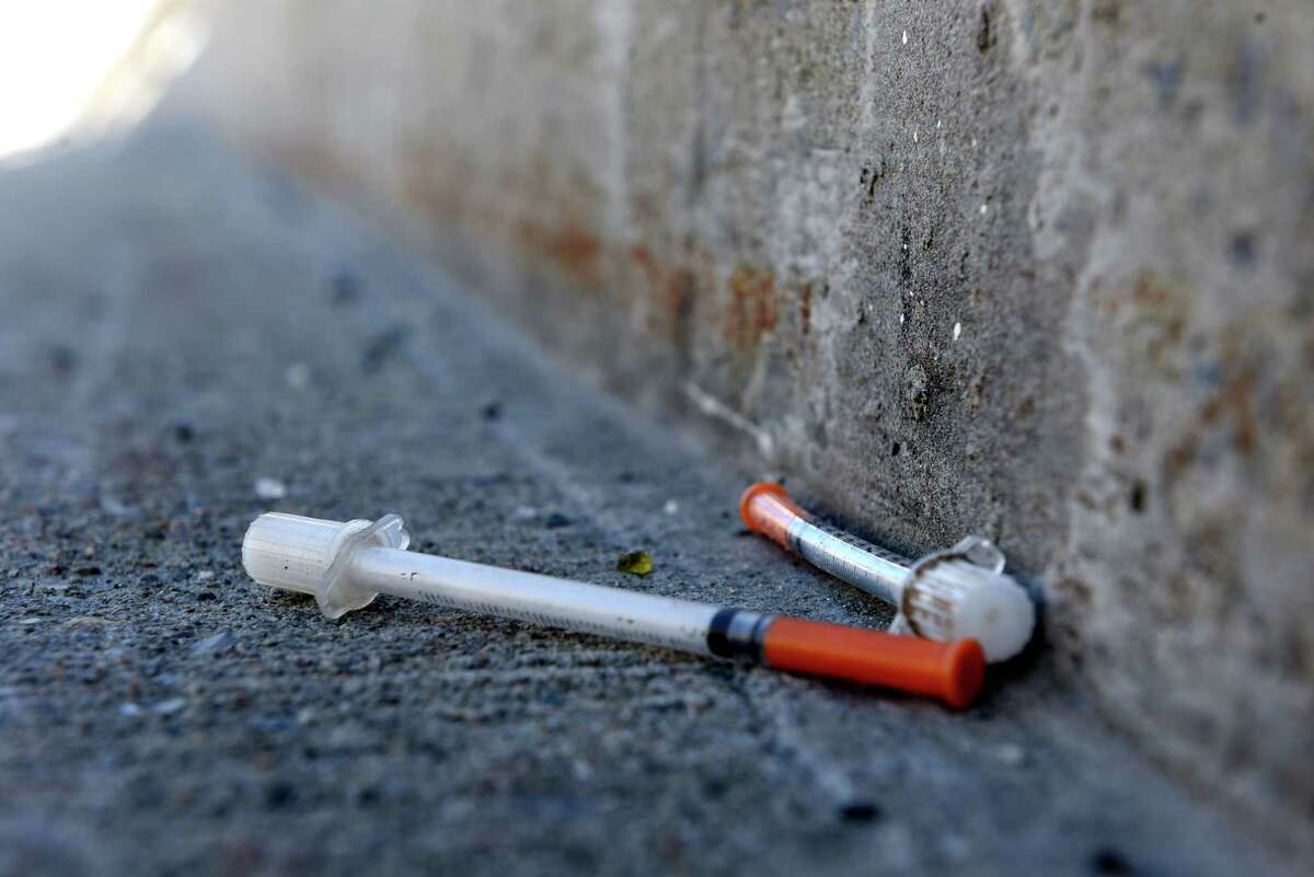 Hypodermic syringes litter the Dunn Memorial Bridge walkway on Monday, Jan. 25, 2021, in Rensselaer, N.Y. (Will Waldron/Times Union)