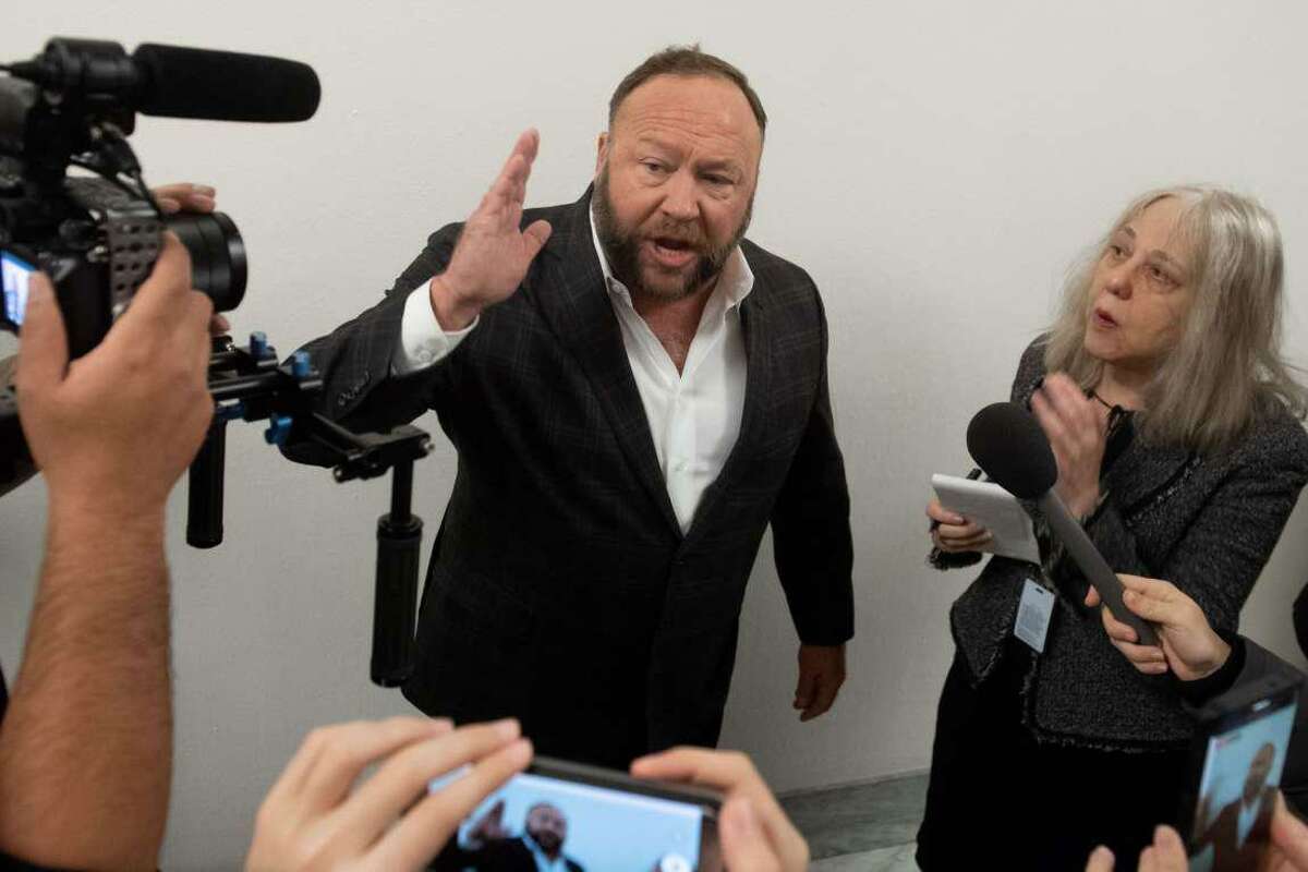 File photo — Extremist Alex Jones speaks outside the hearing room prior to testimony by Google CEO Sundar Pichai during a House Judiciary Committee hearing on Capitol Hill in Washington, DC, Dec. 11, 2018.
