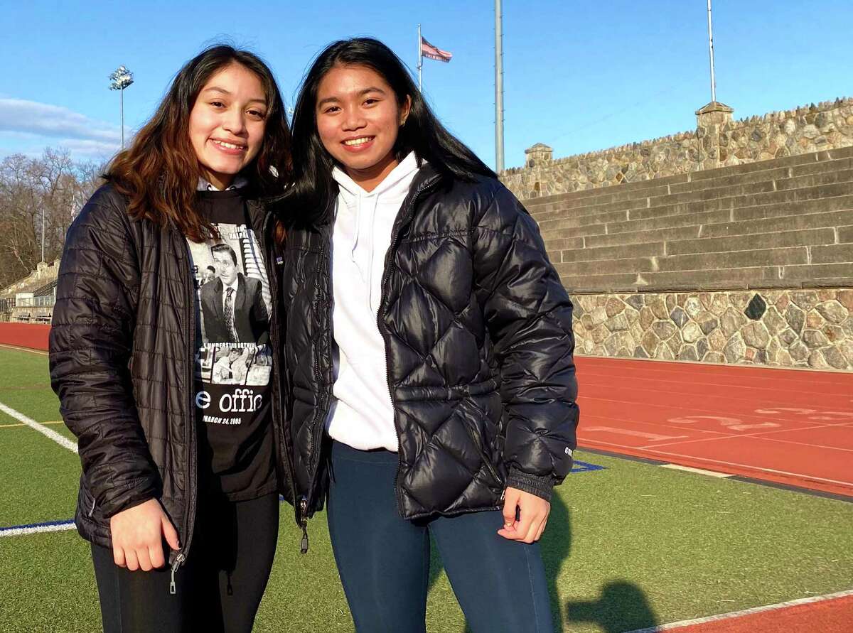 Stamford wrestlers senior Vienna Prado and sophomore Samantha Yap at Boyle Stadium Thursday. A year after the first girls state wrestling tournament, the sport is on hold. Yap was the 106 pound girls state champion last year.
