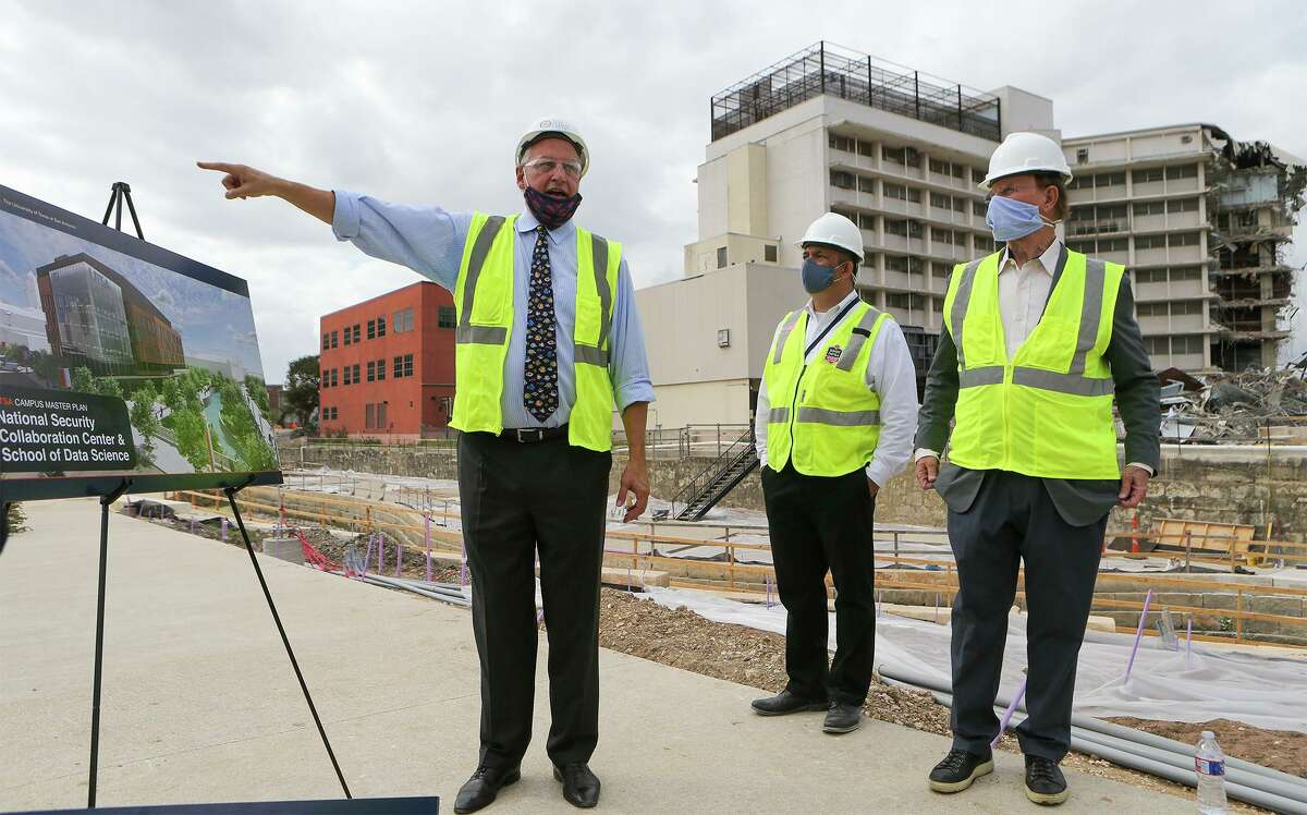UTSA President Taylor Eighmy points to the site of the school's new National Security Collaboration Center and School of Data Science, to be build adjacent to the San Pedro Creek project. Next to Eighmy are Bexar County Judge Nelson Wolff, right, and Bexar County Program Coordinator Tony Canez. Friday, Oct. 23, 2020.