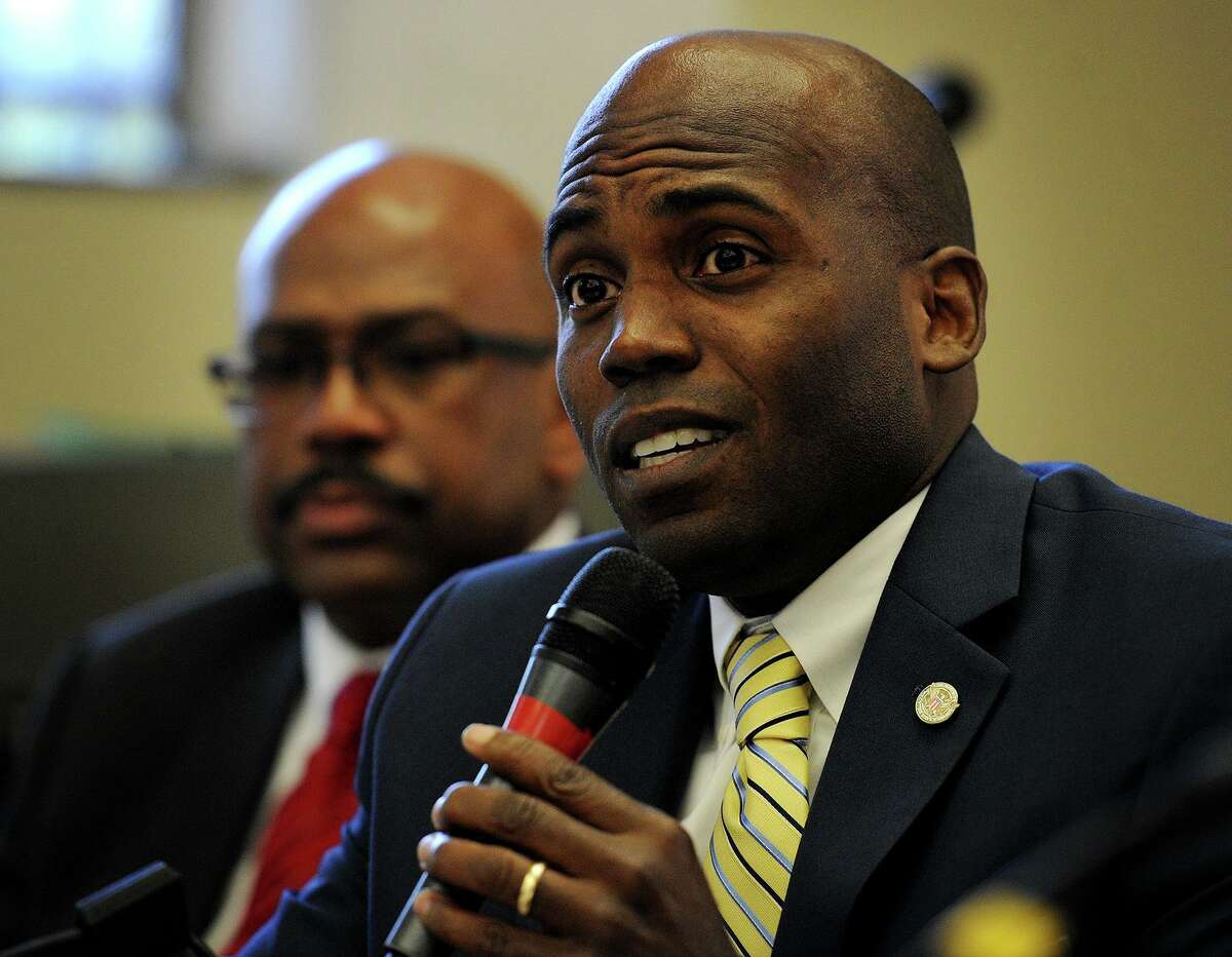 Yohuru Williams addresses an NAACP panel discussion on racism at the Burroughs Library in Bridgeport, Conn. on Monday, June 29, 2015.