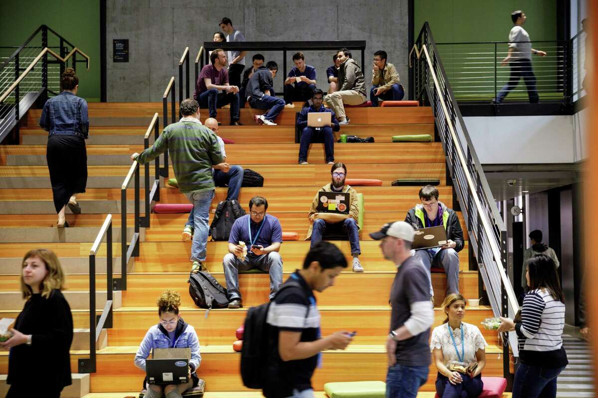 A 2017 press photo distributed by Amazon of workers at a Seattle headquarters campus. (press photo via Amazon)