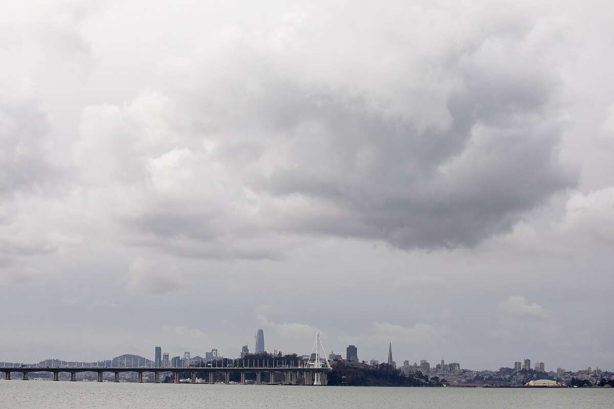 Dark clouds gather in the skies above the San Francisco Bay as a storm moves into the region, seen from Emeryville Marina in Emeryville, Calif. Tuesday, January 26, 2021.