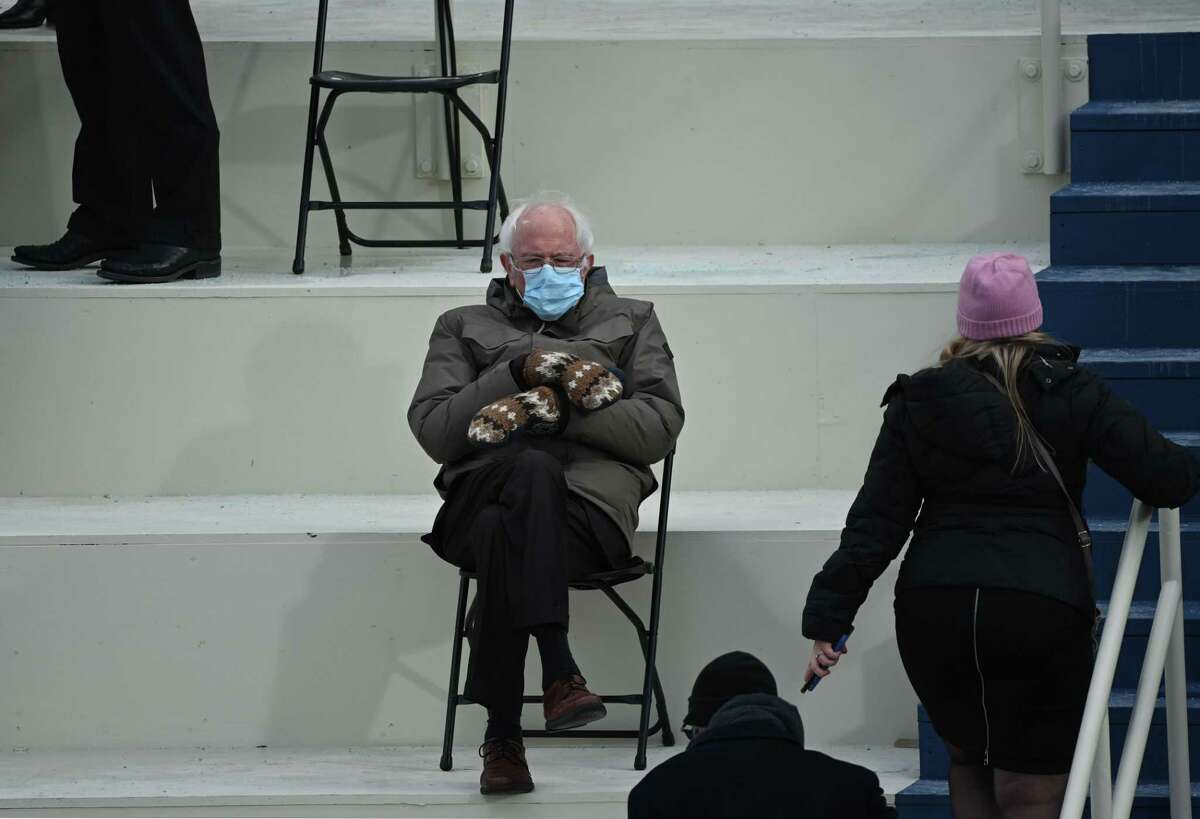 Sen. Bernie Sanders sits in the bleachers on Capitol Hill before Joe Biden is sworn in as the 46th US President on January 20, 2021, at the US Capitol in Washington, D.C. Images)