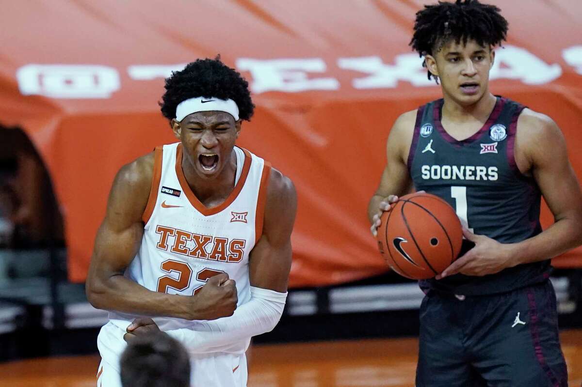 Texas forward Kai Jones (22) reacts after scoring against Oklahoma during the second half of an NCAA college basketball game Tuesday, Jan. 26, 2021, in Austin, Texas. (AP Photo/Eric Gay)