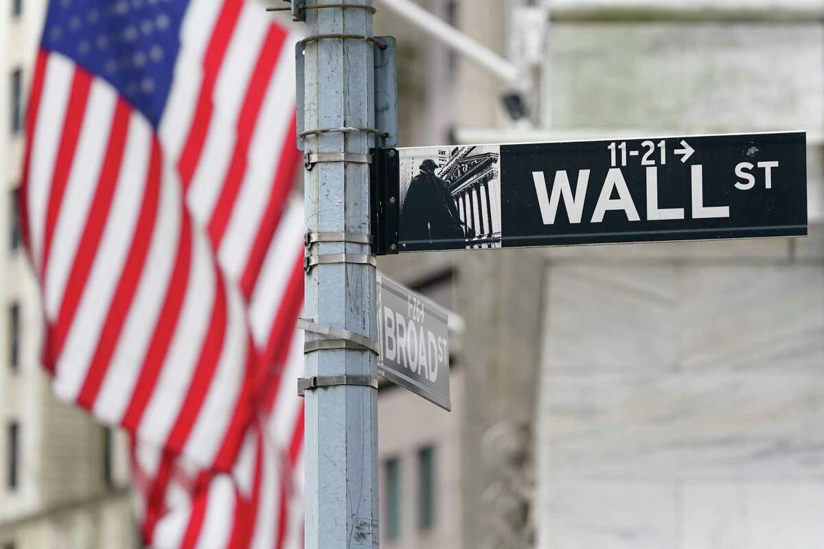 FILE - A street sign is displayed at the New York Stock Exchange in New York, Monday, Nov. 23, 2020.